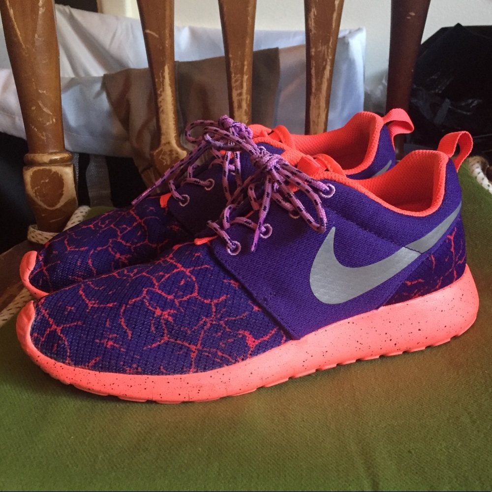 Purple and pink Nike roshes